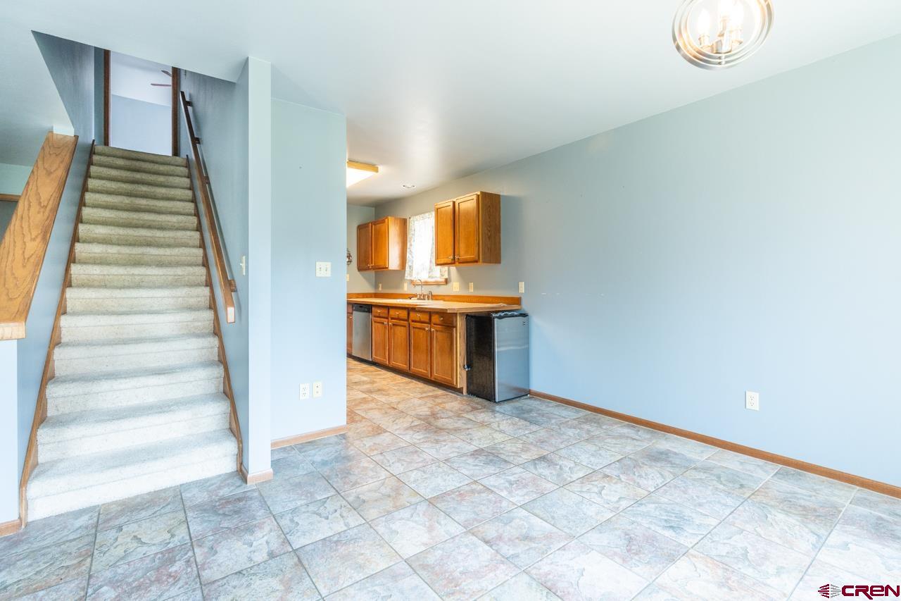 37480 Highway 50, Unit 2 Gunnison, CO 81230 - Photo 7 of 27 a view of a kitchen with wooden floor and electronic appliances