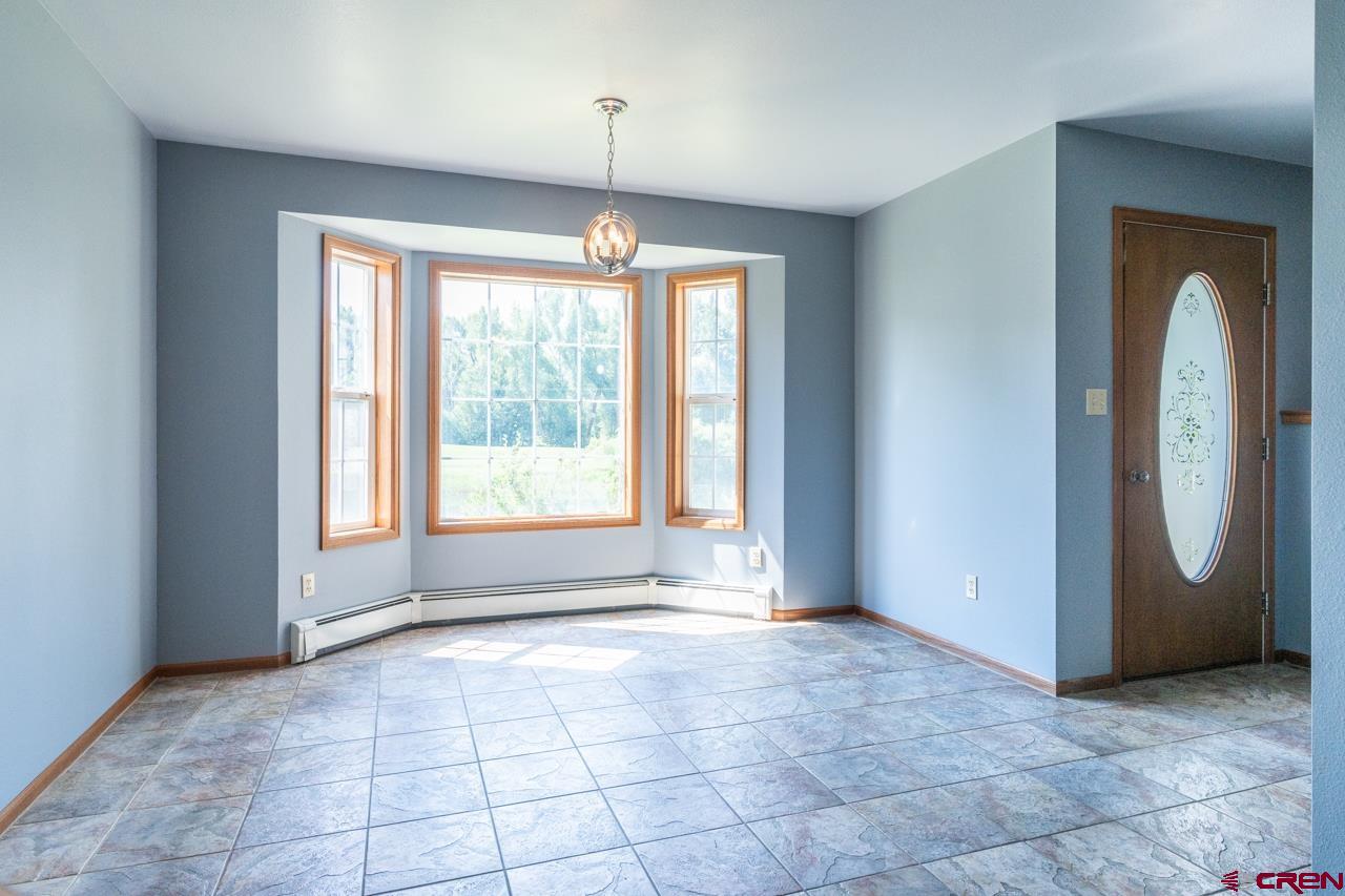 37480 Highway 50, Unit 2 Gunnison, CO 81230 - Photo 9 of 27 a view of an empty room with a window