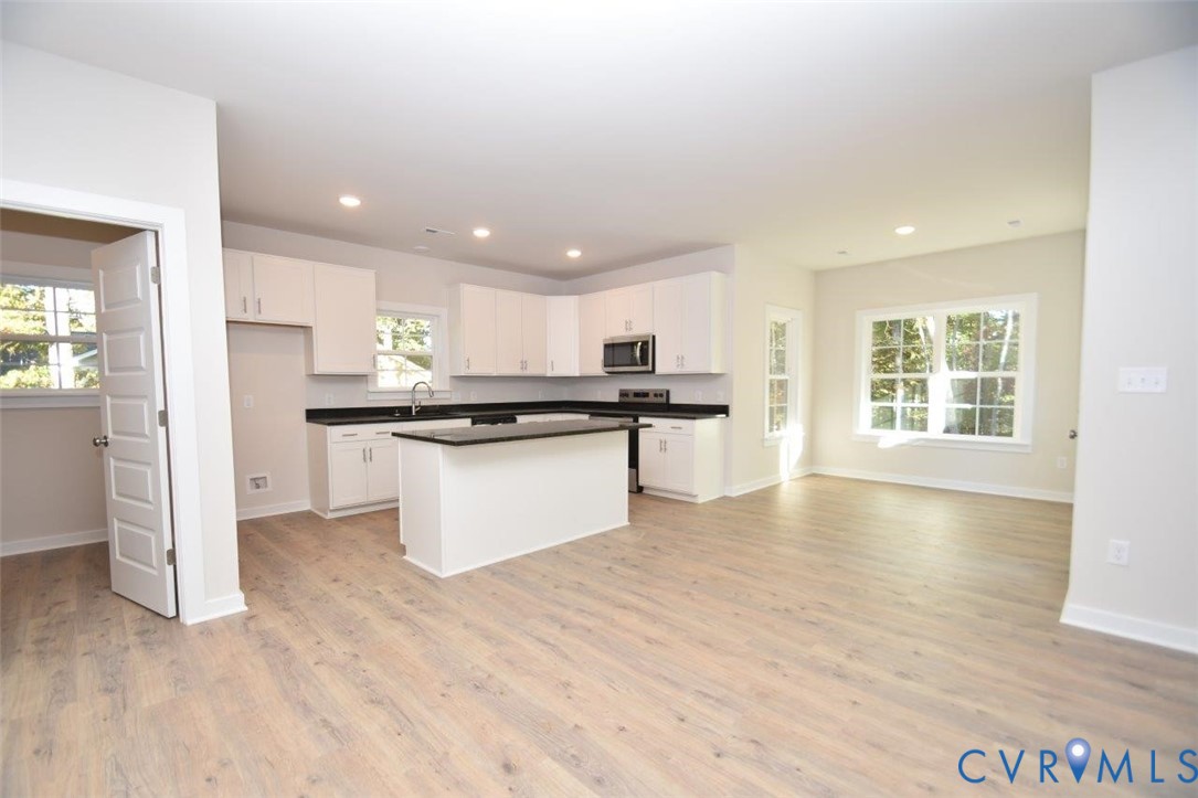 11675 Hanback Road Gordonsville, VA 22942 - Photo 5 of 19 Kitchen featuring dark countertops, white cabinets