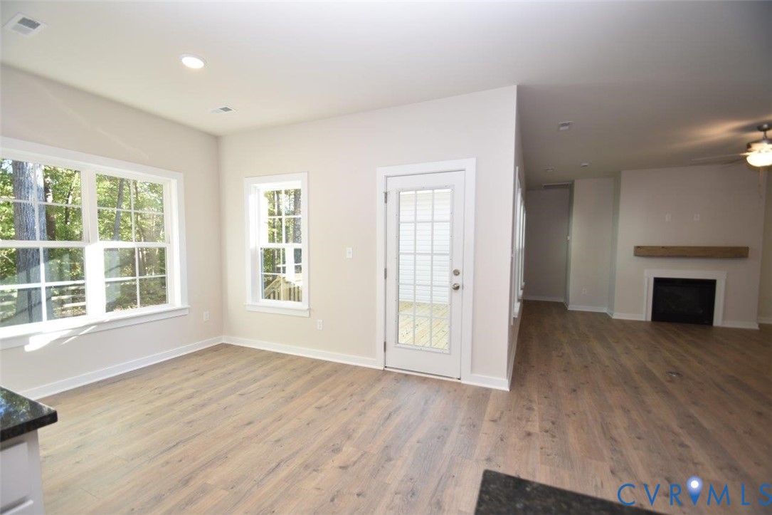 11675 Hanback Road Gordonsville, VA 22942 - Photo 8 of 19 Unfurnished living room with a fireplace, light wo
