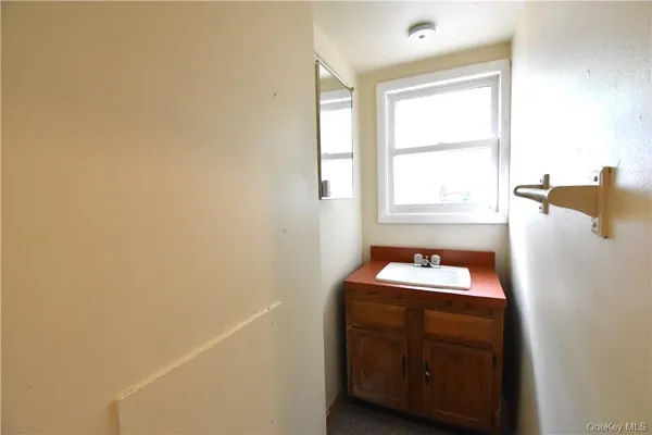 a room with a window and washer