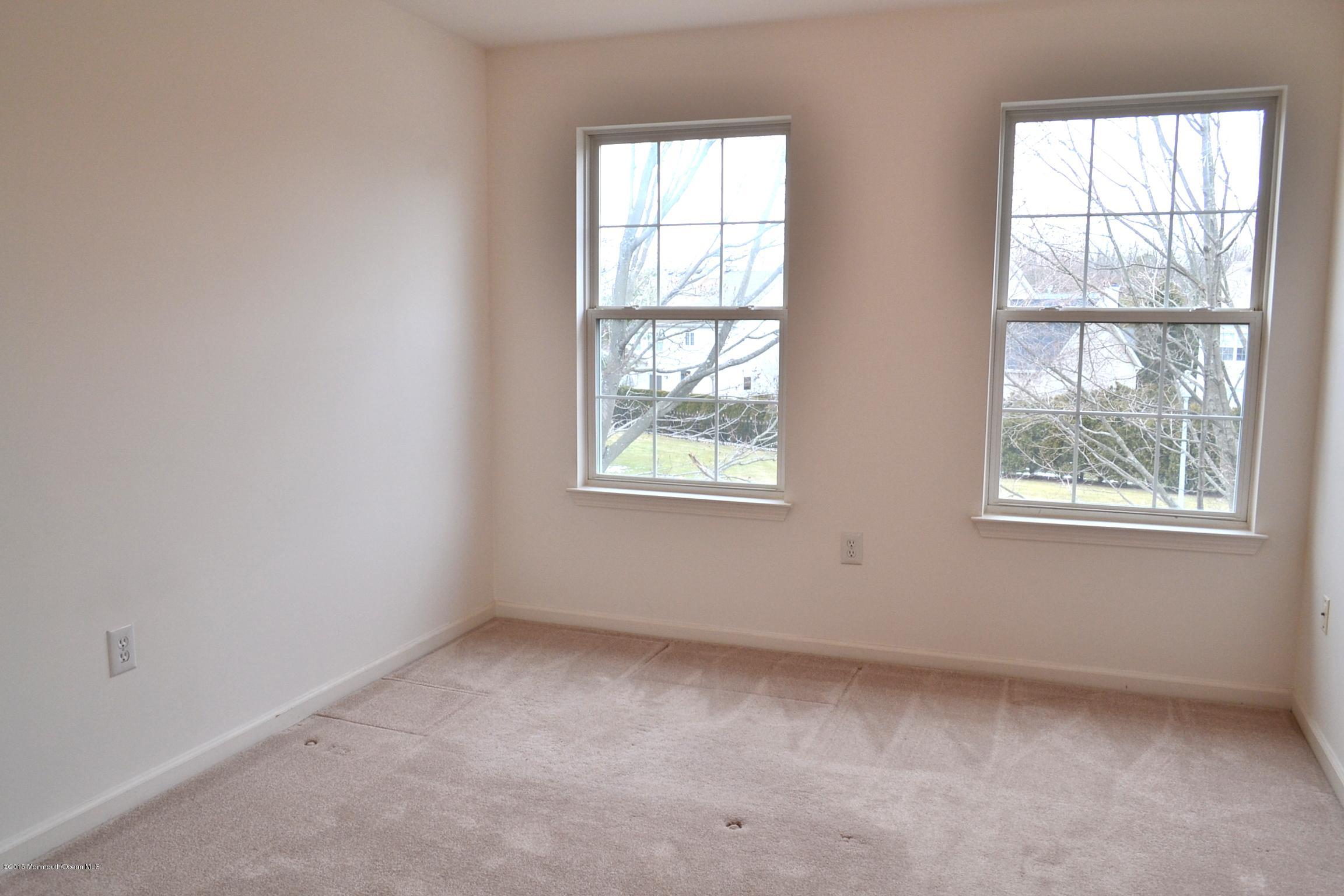 23 Bernadette Road Morganville, NJ 07751 - Photo 16 of 26 an empty room with windows