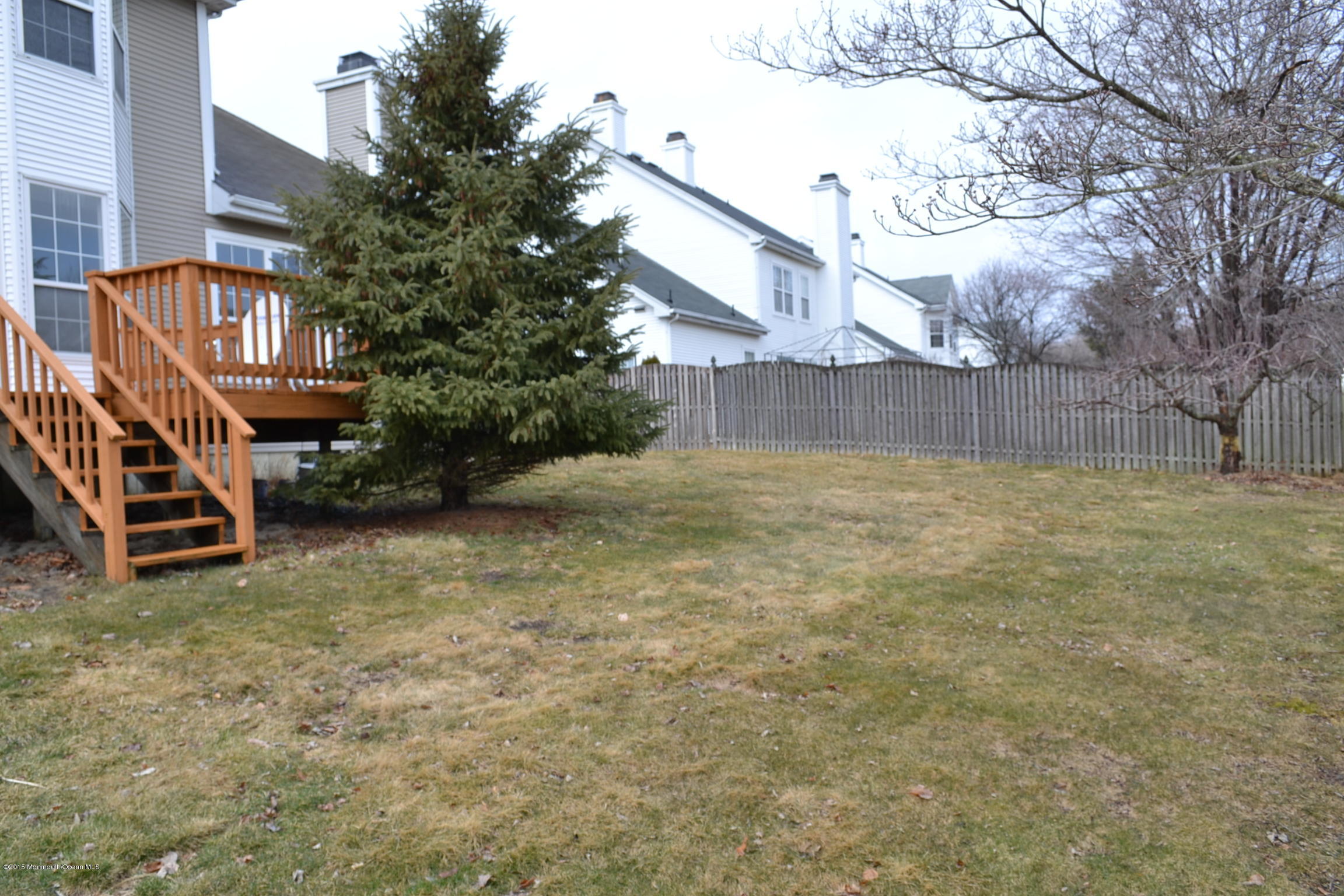 23 Bernadette Road Morganville, NJ 07751 - Photo 25 of 26 a view of a backyard with a small cabin