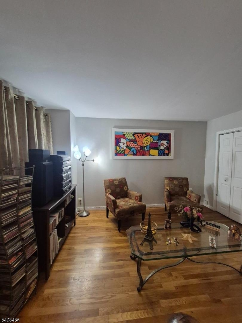 67 Marne Street Newark, NJ 07105 - Photo 4 of 18 a living room with furniture and a flat screen tv