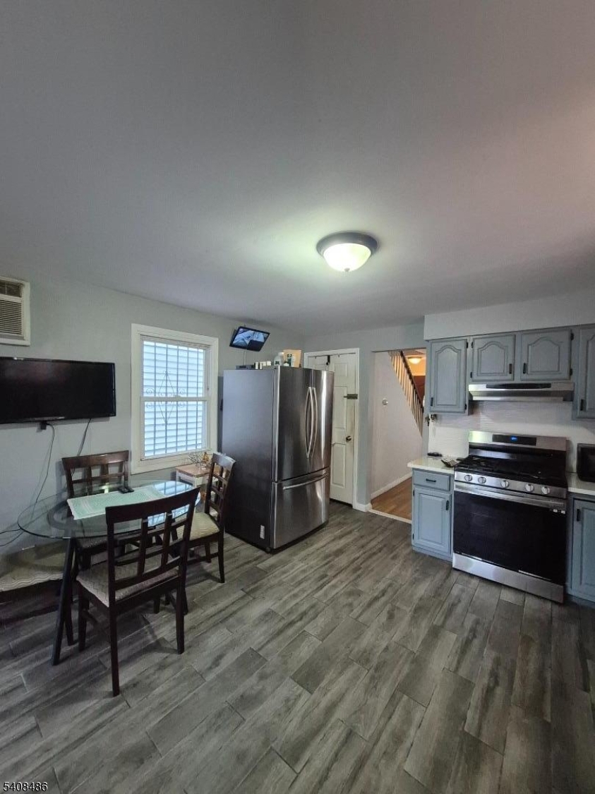 67 Marne Street Newark, NJ 07105 - Photo 8 of 18 a kitchen with stainless steel appliances granite countertop a stove and a refrigerator
