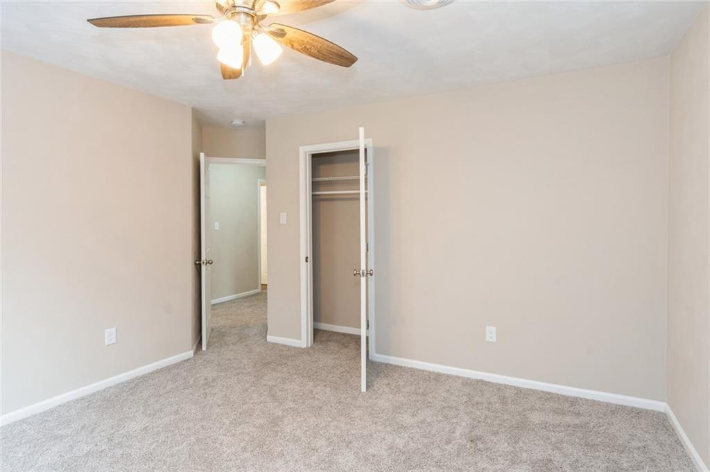 218 Chestnut Lane Chalk Hill, PA 15421 - Photo 12 of 18 an empty room with closet and a chandelier fan