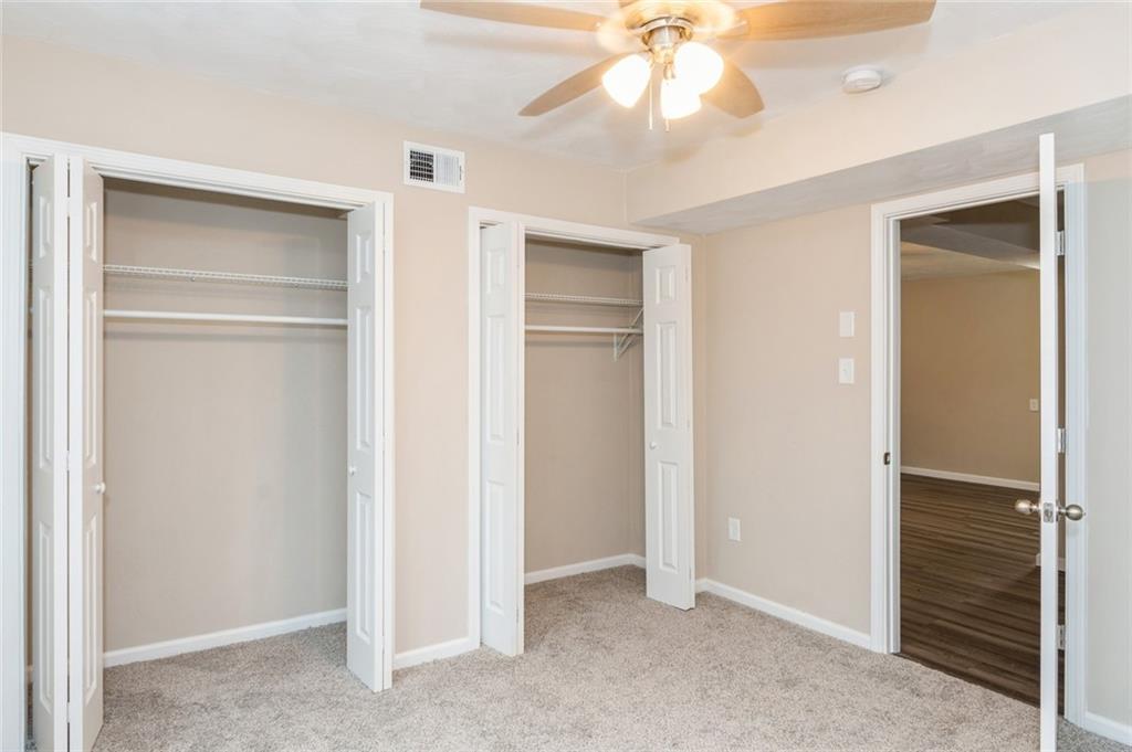 218 Chestnut Lane Chalk Hill, PA 15421 - Photo 14 of 18 a view of an empty room with a ceiling fan