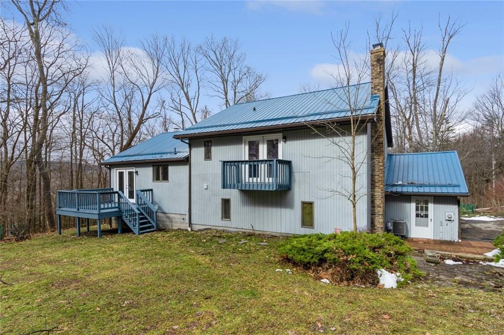218 Chestnut Lane Chalk Hill, PA 15421 - Photo 3 of 18 a front view of a house with garden