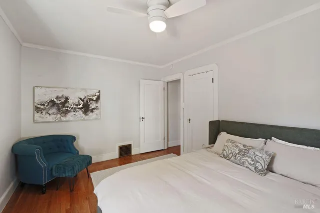 a living room with furniture and a mirror