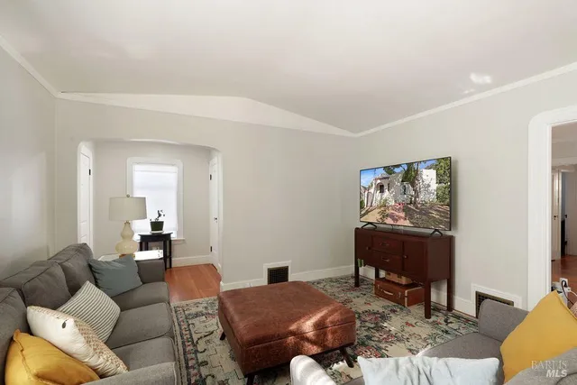 a living room with furniture a window and a fireplace