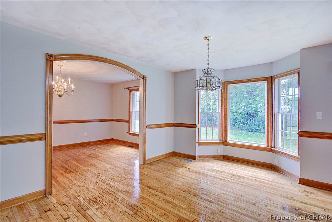 140 Mill Point Road Hudgins, VA 23076 - Photo 12 of 47 a view of empty room with wooden floor and fan