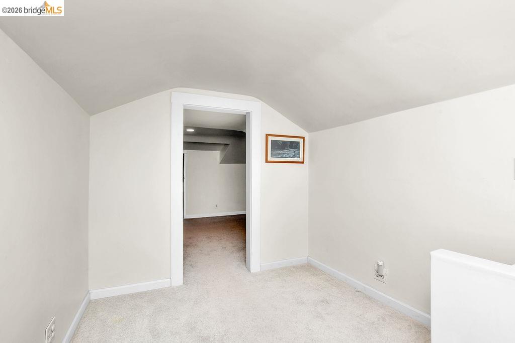 325 South 2nd Street Rio Vista, CA 94571 - Photo 19 of 33 Carpeted room featuring a white interior, sloped ceiling, and white baseboards