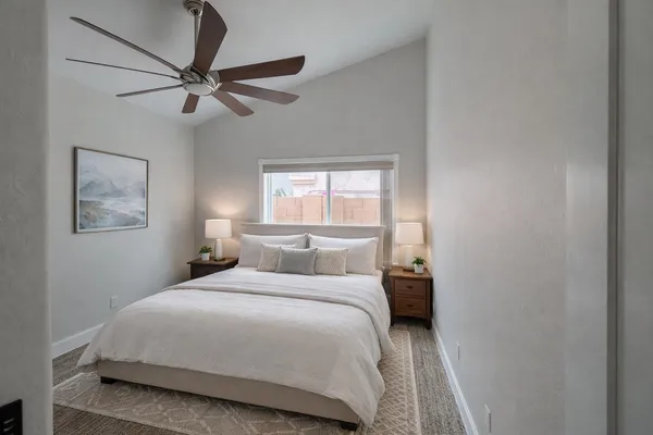 a bedroom with a bed and window