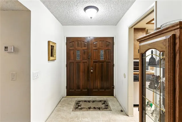 a room with furniture and white walls