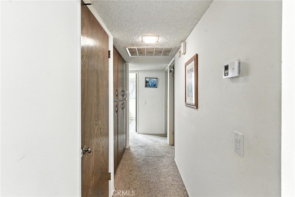 2924 Raccoon Drive Lake Isabella, CA 93240 - Photo 17 of 33 a view of a hallway with wooden shelves