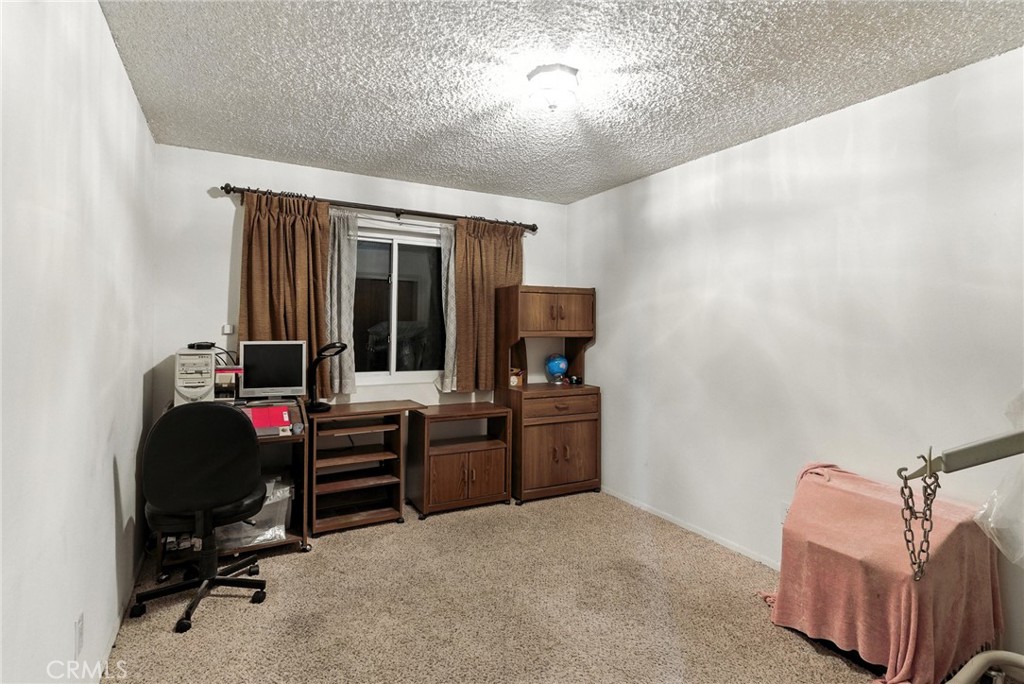 2924 Raccoon Drive Lake Isabella, CA 93240 - Photo 18 of 33 a view of a workspace with furniture and a window
