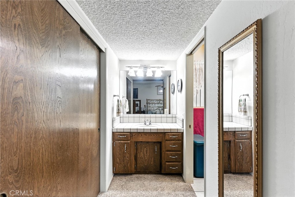 2924 Raccoon Drive Lake Isabella, CA 93240 - Photo 25 of 33 a bathroom with a sink and a mirror