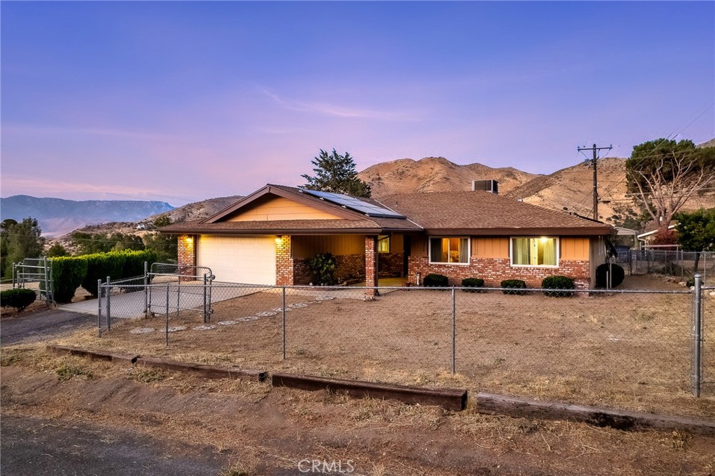 2924 Raccoon Drive Lake Isabella, CA 93240 - Photo 29 of 33 a front view of a house with a yard and garage