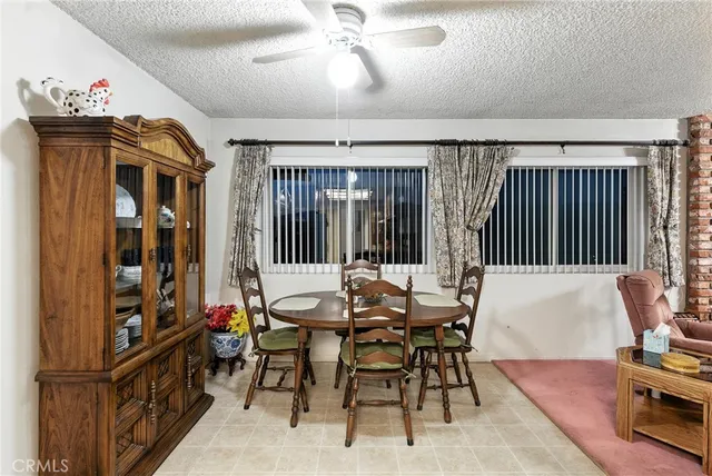 a living room with furniture gym equipment and a flat screen tv