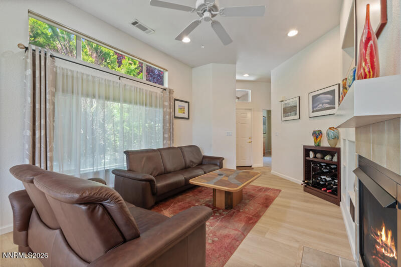 403 Sierra Leaf Circle Reno, NV 89511 - Photo 5 of 25 a living room with furniture and a large window