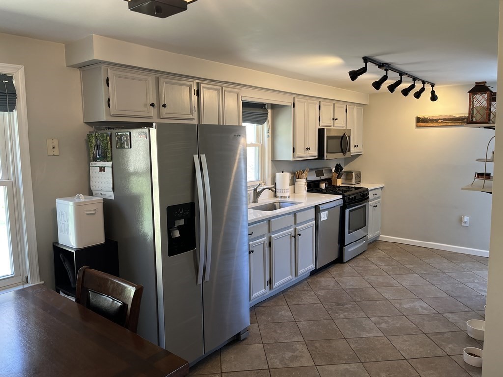 86 East Buckland Road Buckland, MA 01370 - Photo 14 of 39 a kitchen with stainless steel appliances a refrigerator and a stove
