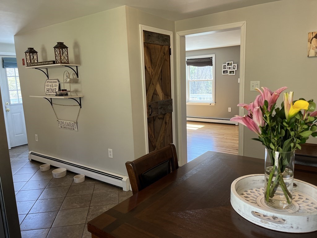 86 East Buckland Road Buckland, MA 01370 - Photo 16 of 39 a living room with furniture and a potted plant