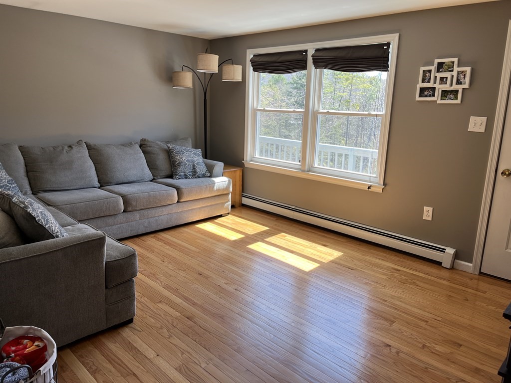 86 East Buckland Road Buckland, MA 01370 - Photo 17 of 39 a living room with furniture and wooden floor