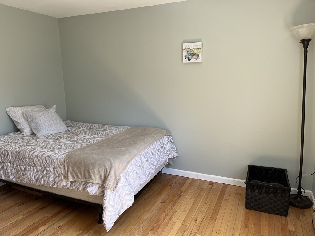 86 East Buckland Road Buckland, MA 01370 - Photo 21 of 39 a bedroom with a bed and a night stand