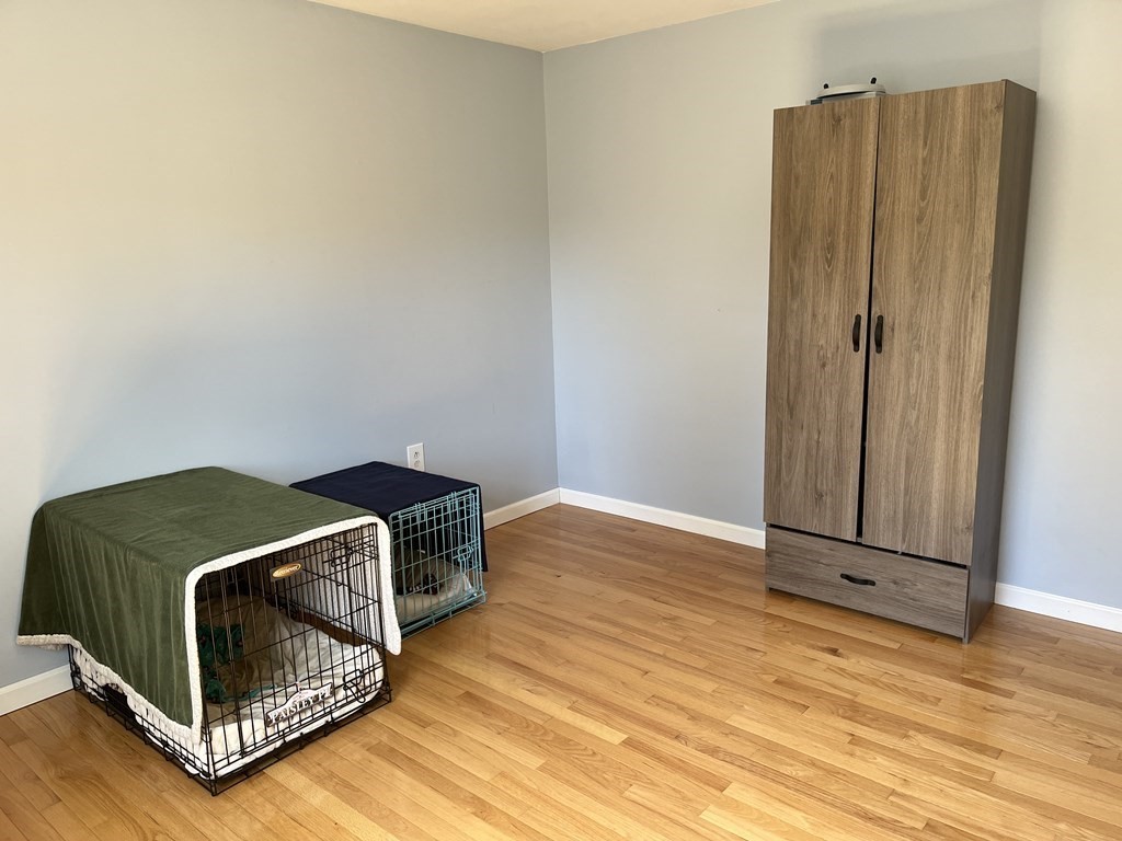 86 East Buckland Road Buckland, MA 01370 - Photo 24 of 39 a room with a fireplace and wooden floor