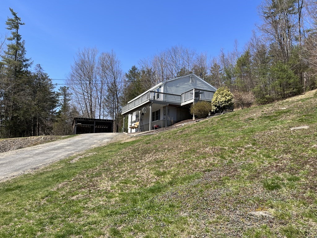 86 East Buckland Road Buckland, MA 01370 - Photo 3 of 39 a front view of a house with a yard and trees