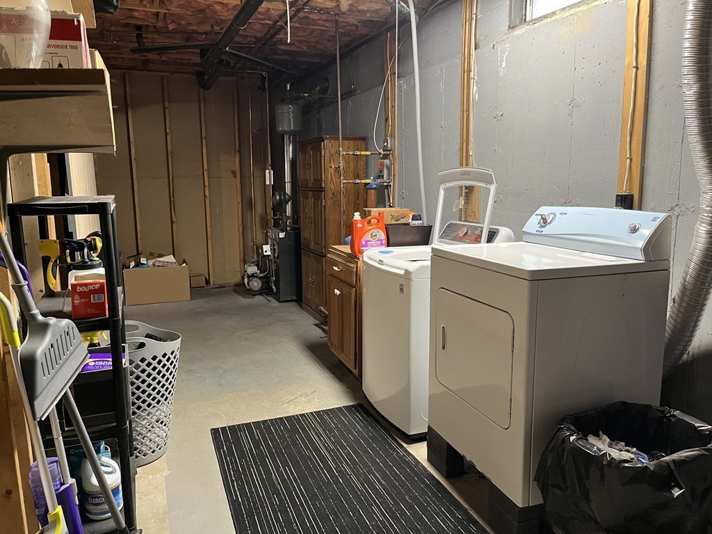 86 East Buckland Road Buckland, MA 01370 - Photo 32 of 39 a storage room with washer and dryer