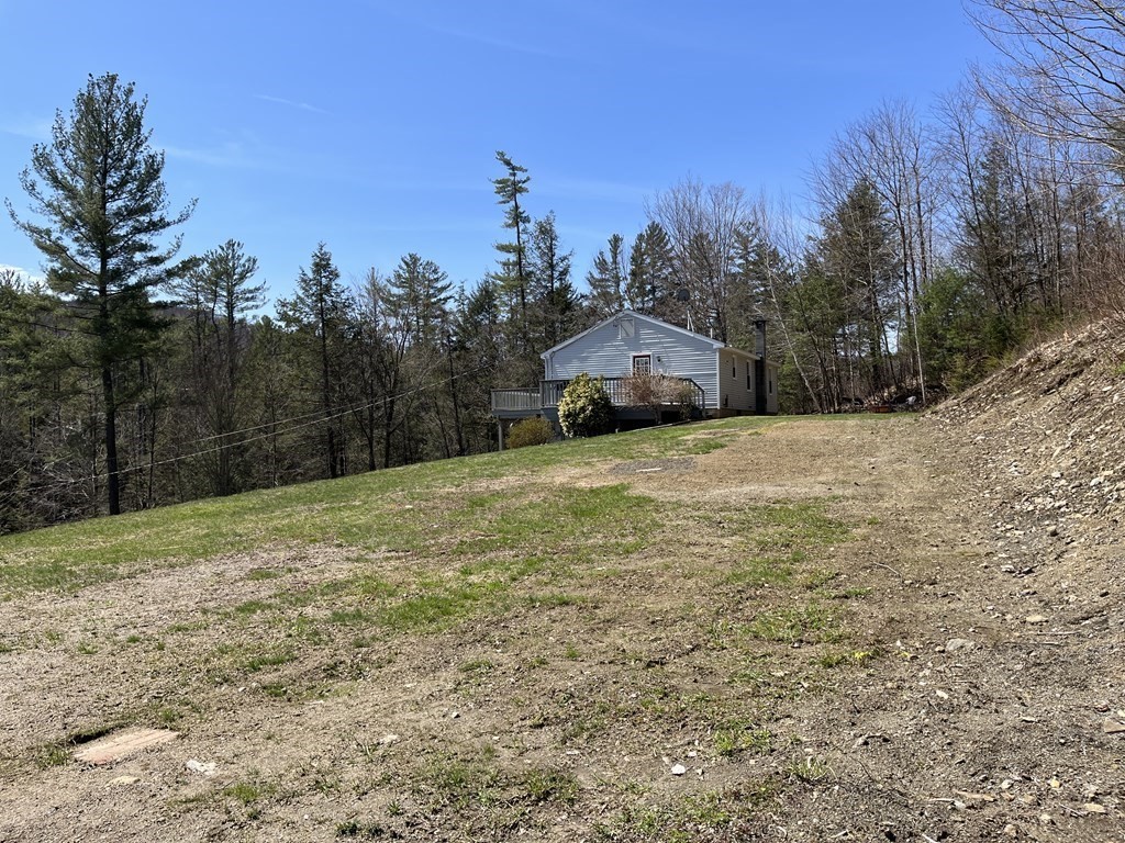 86 East Buckland Road Buckland, MA 01370 - Photo 4 of 39 a view of a yard with a house in the background