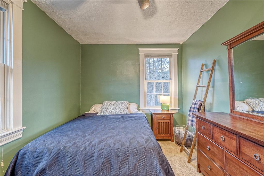 7520 Noblestown Road McDonald, PA 15057 - Photo 16 of 25 a bed room with a bed and a large window