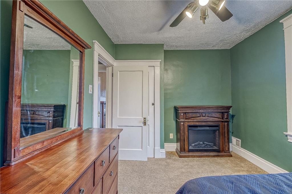 7520 Noblestown Road McDonald, PA 15057 - Photo 17 of 25 workspace with fireplace and wooden floor