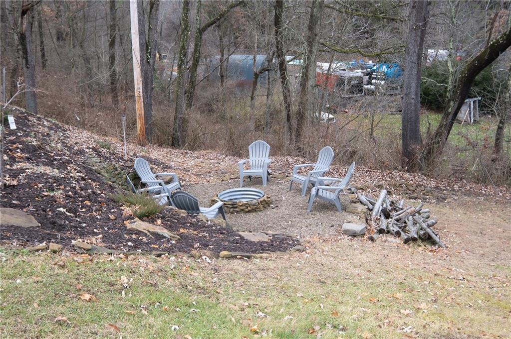 7520 Noblestown Road McDonald, PA 15057 - Photo 21 of 25 a backyard of a house with table and chairs