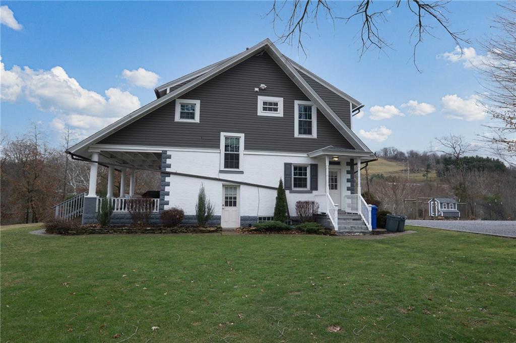 7520 Noblestown Road McDonald, PA 15057 - Photo 23 of 25 a front view of a house with a yard and sitting area
