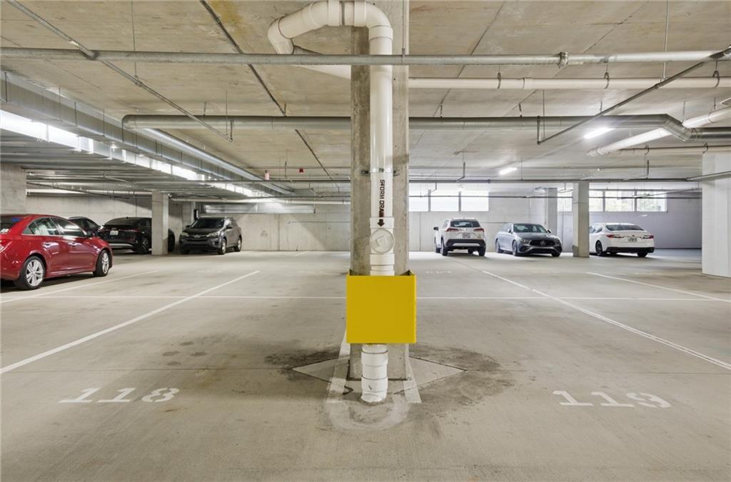 775 Juniper Street Northeast, Unit 322 Atlanta, GA 30308 - Photo 19 of 34 a view of parking garage with cars