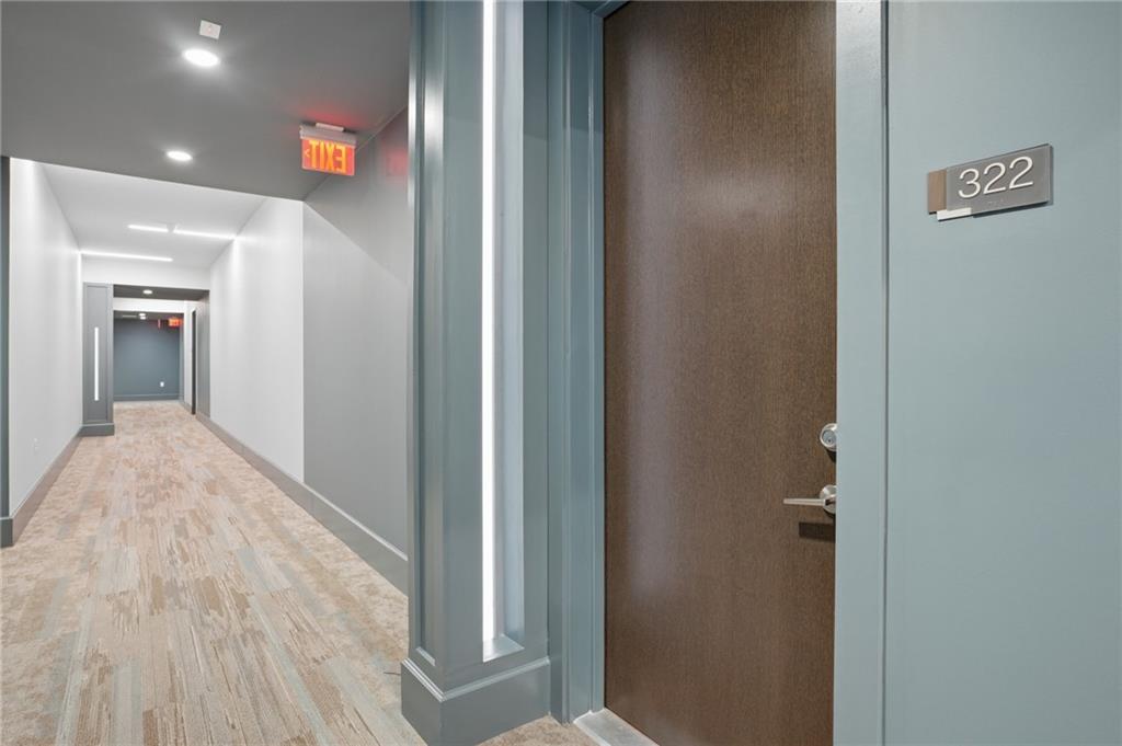 775 Juniper Street Northeast, Unit 322 Atlanta, GA 30308 - Photo 2 of 34 a view of a hallway with wooden floor
