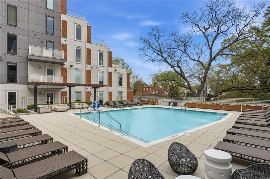 775 Juniper Street Northeast, Unit 322 Atlanta, GA 30308 - Photo 23 of 34 a view of a swimming pool with a patio