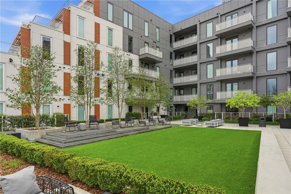 775 Juniper Street Northeast, Unit 322 Atlanta, GA 30308 - Photo 27 of 34 a building view with swimming pool and sitting space