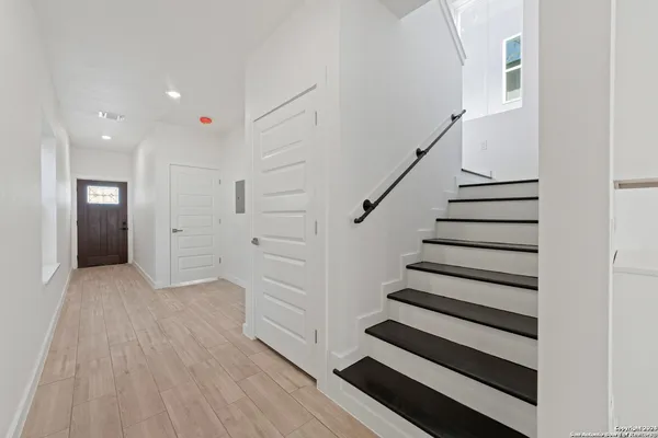 a view of entryway with wooden floor
