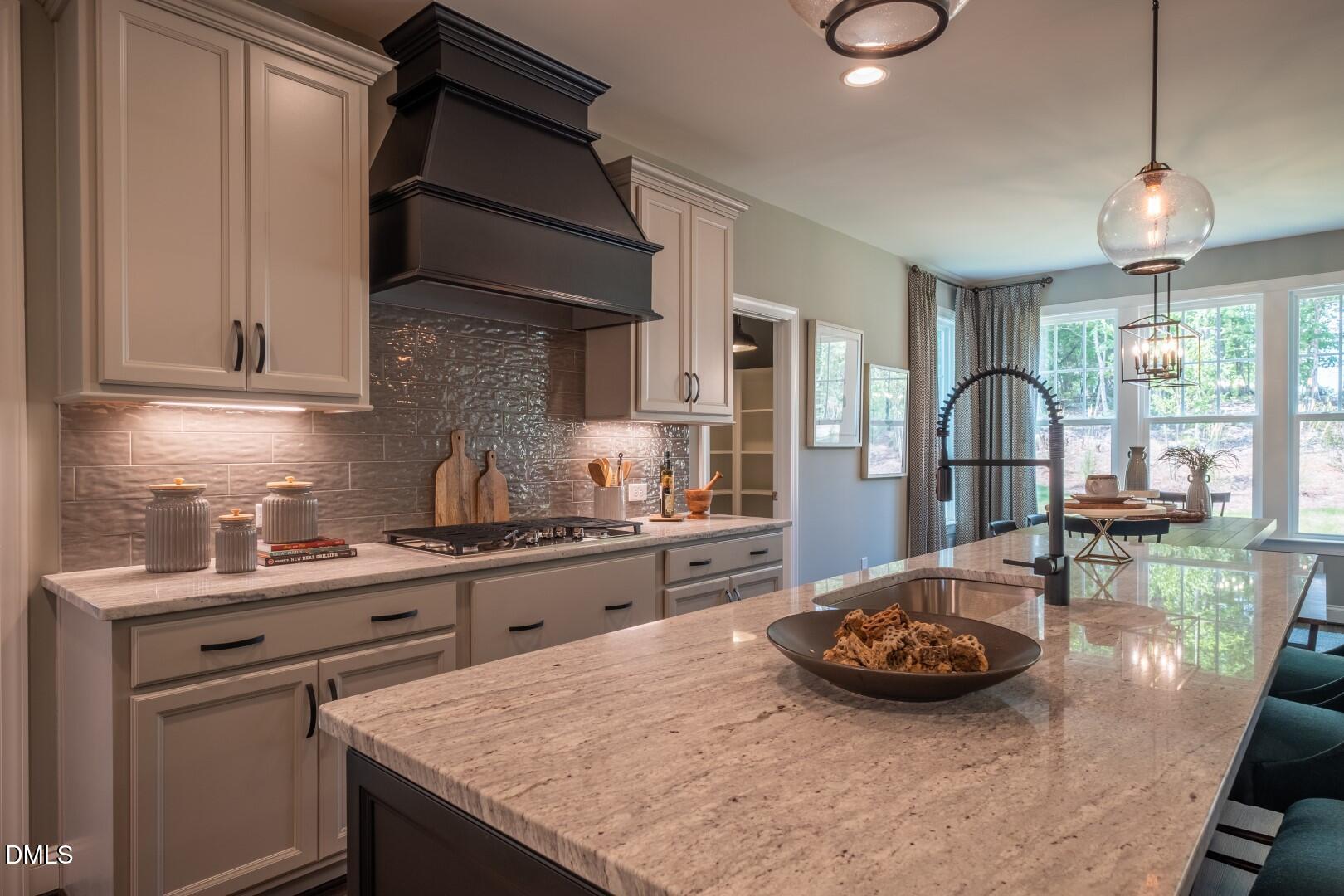 326 Oak Meadow Lane Angier, NC 27501 - Photo 15 of 41 a kitchen with a sink stove and cabinets