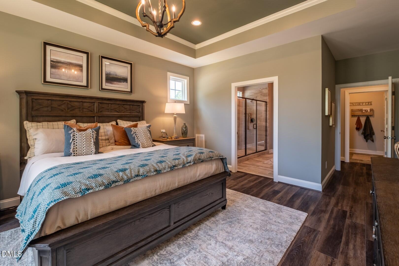 326 Oak Meadow Lane Angier, NC 27501 - Photo 19 of 41 a bedroom with a bed and wooden floor