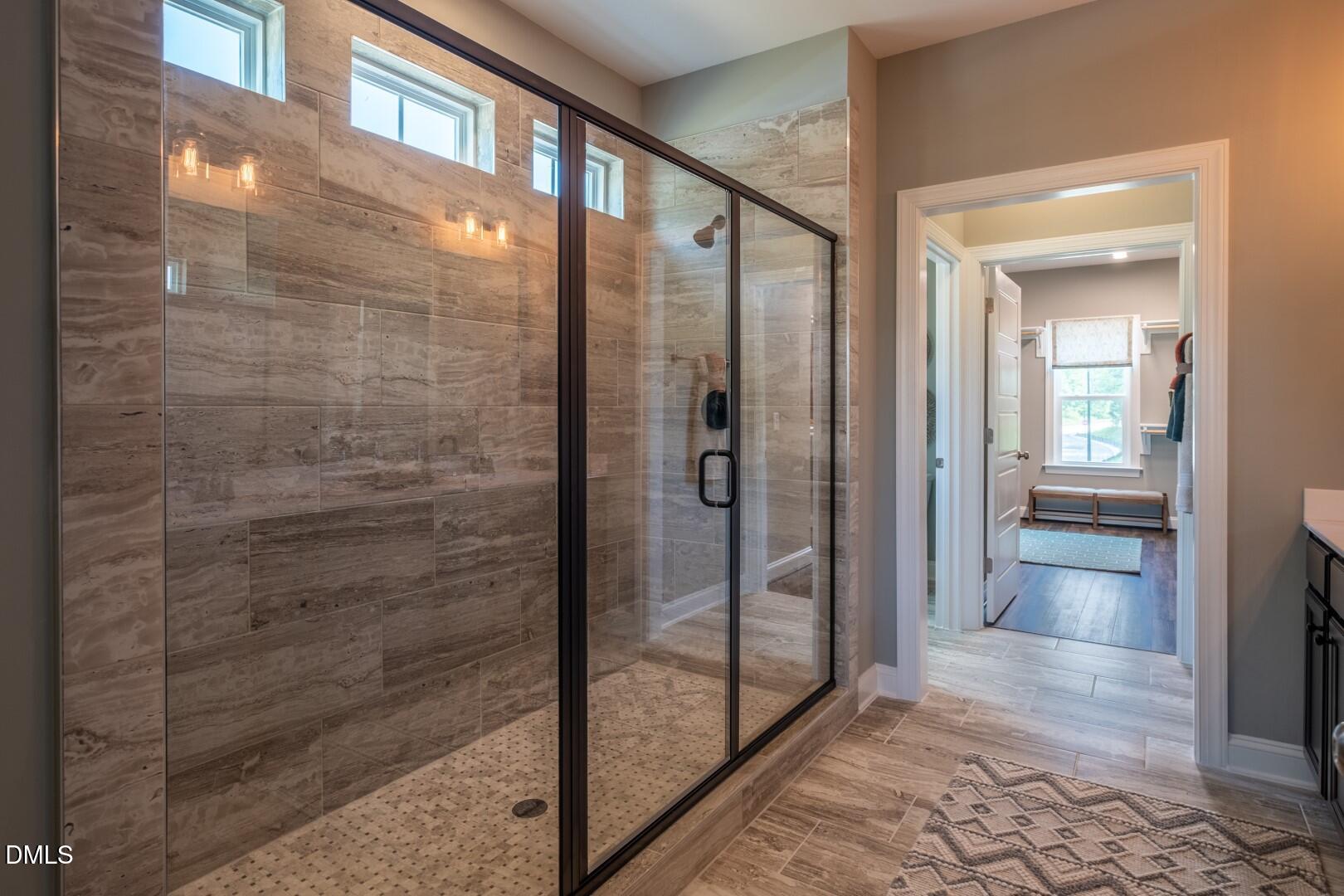 326 Oak Meadow Lane Angier, NC 27501 - Photo 21 of 41 a bathroom with a glass shower door