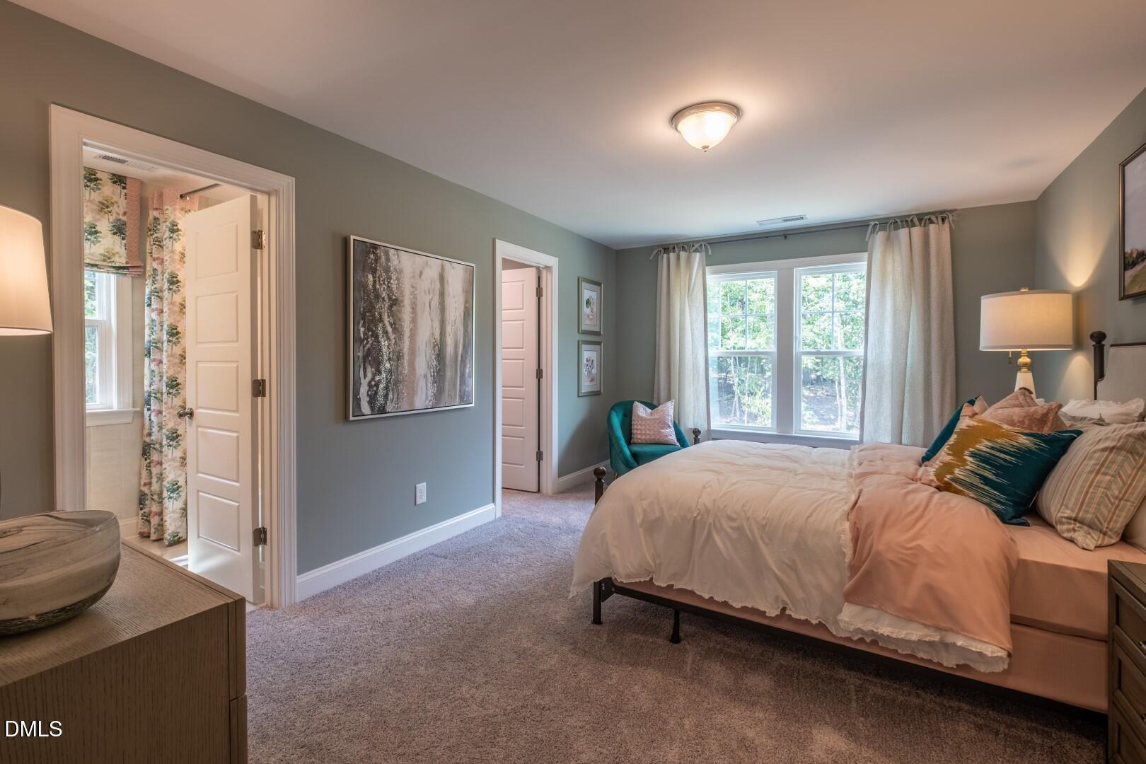 326 Oak Meadow Lane Angier, NC 27501 - Photo 28 of 41 a bedroom with a bed and a window