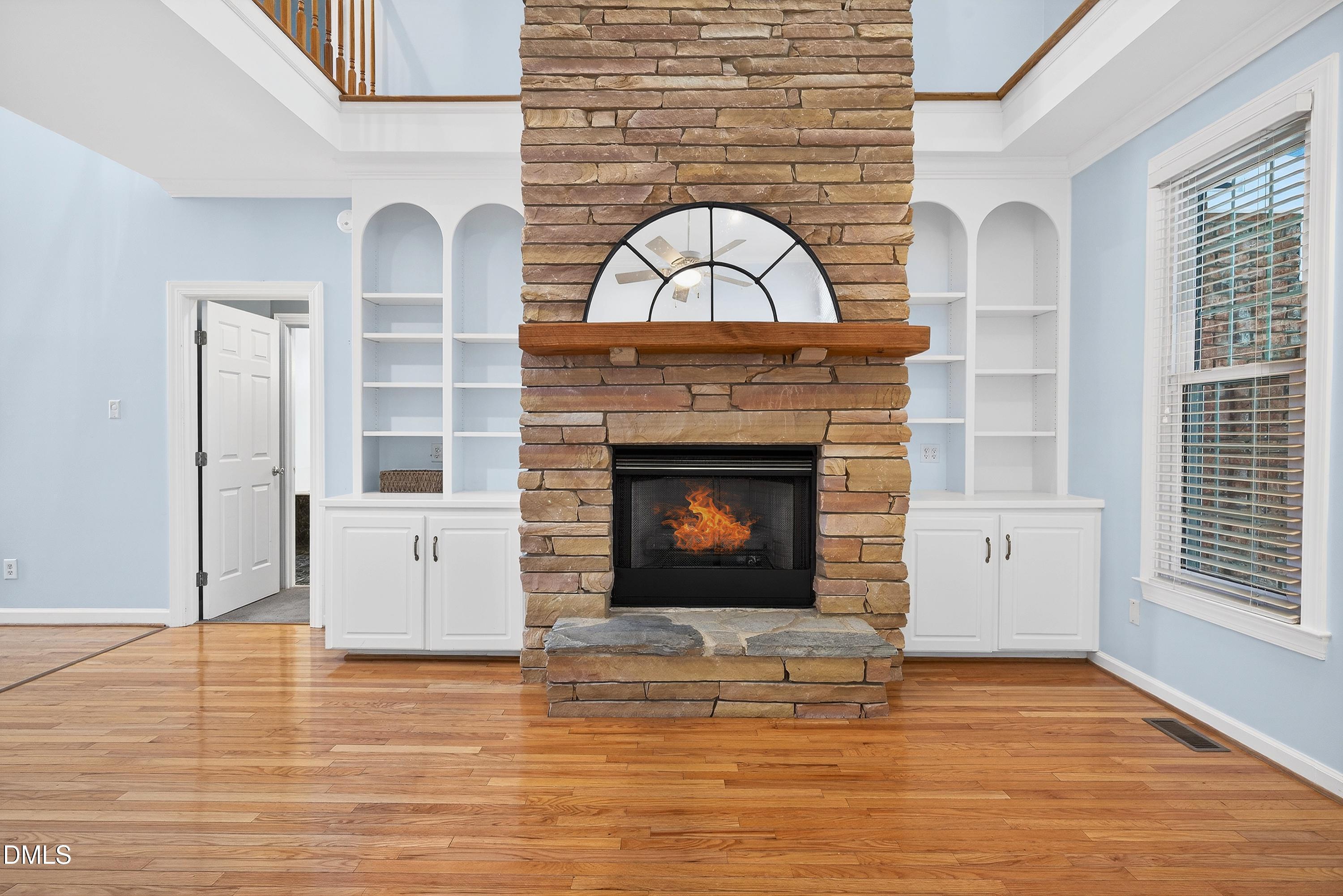 2217 Moss Point Lane Raleigh, NC 27606 - Photo 9 of 70 a view of a livingroom with a fireplace and window