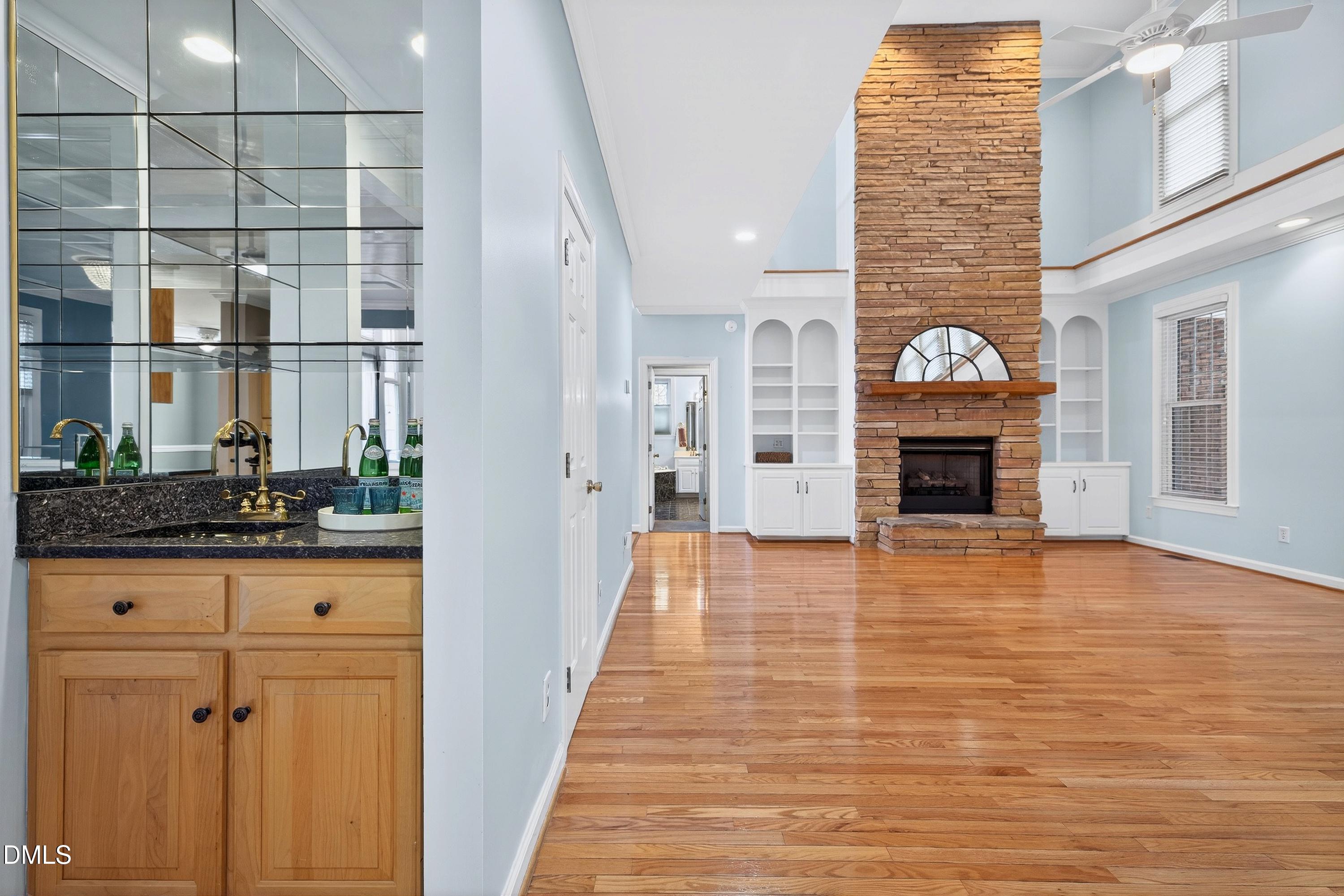 2217 Moss Point Lane Raleigh, NC 27606 - Photo 13 of 70 a view of empty room with wooden floor and fireplace