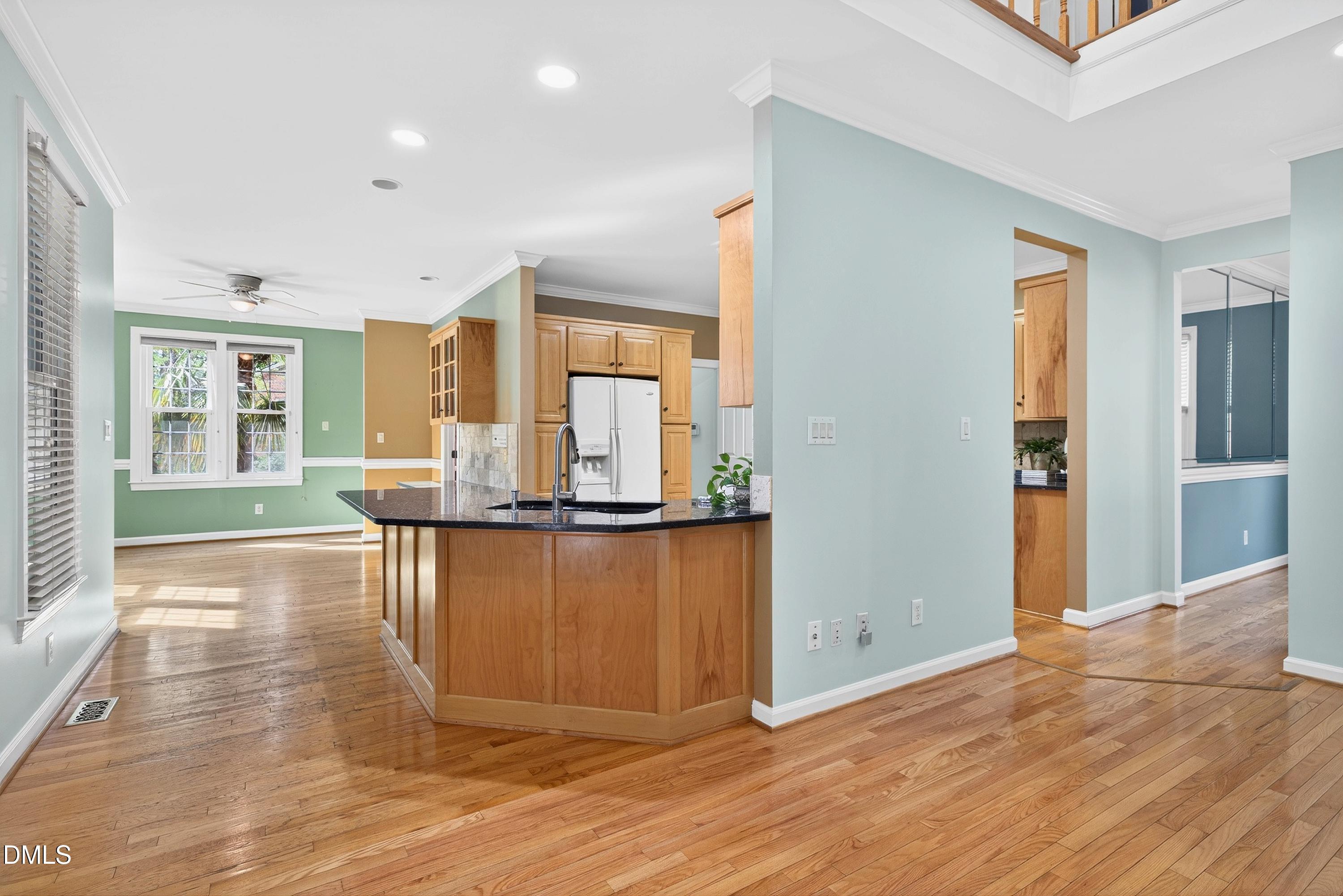 2217 Moss Point Lane Raleigh, NC 27606 - Photo 20 of 70 a view of a living room kitchen and a wooden floor