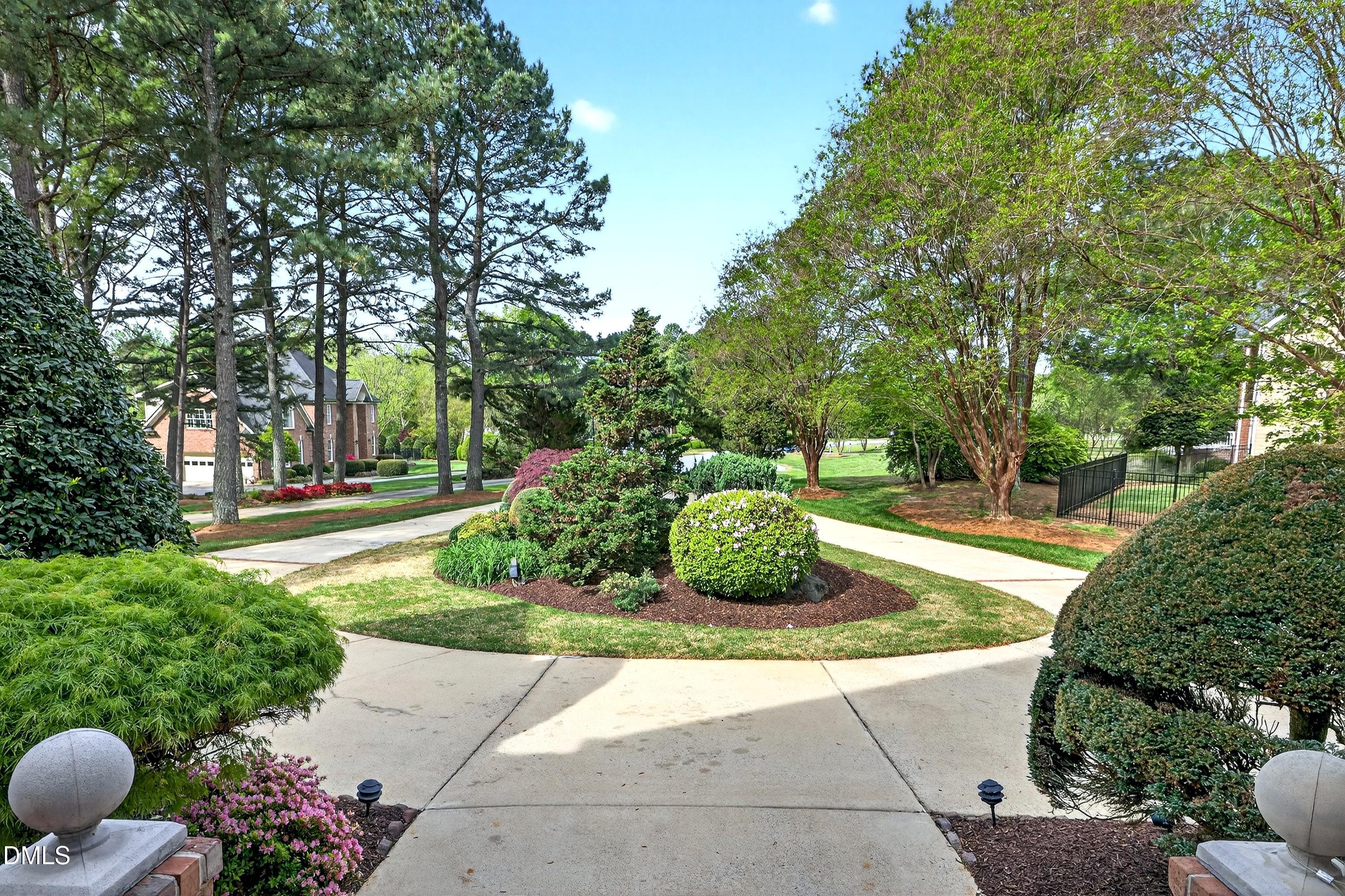 2217 Moss Point Lane Raleigh, NC 27606 - Photo 2 of 70 a view of a garden with a fountain