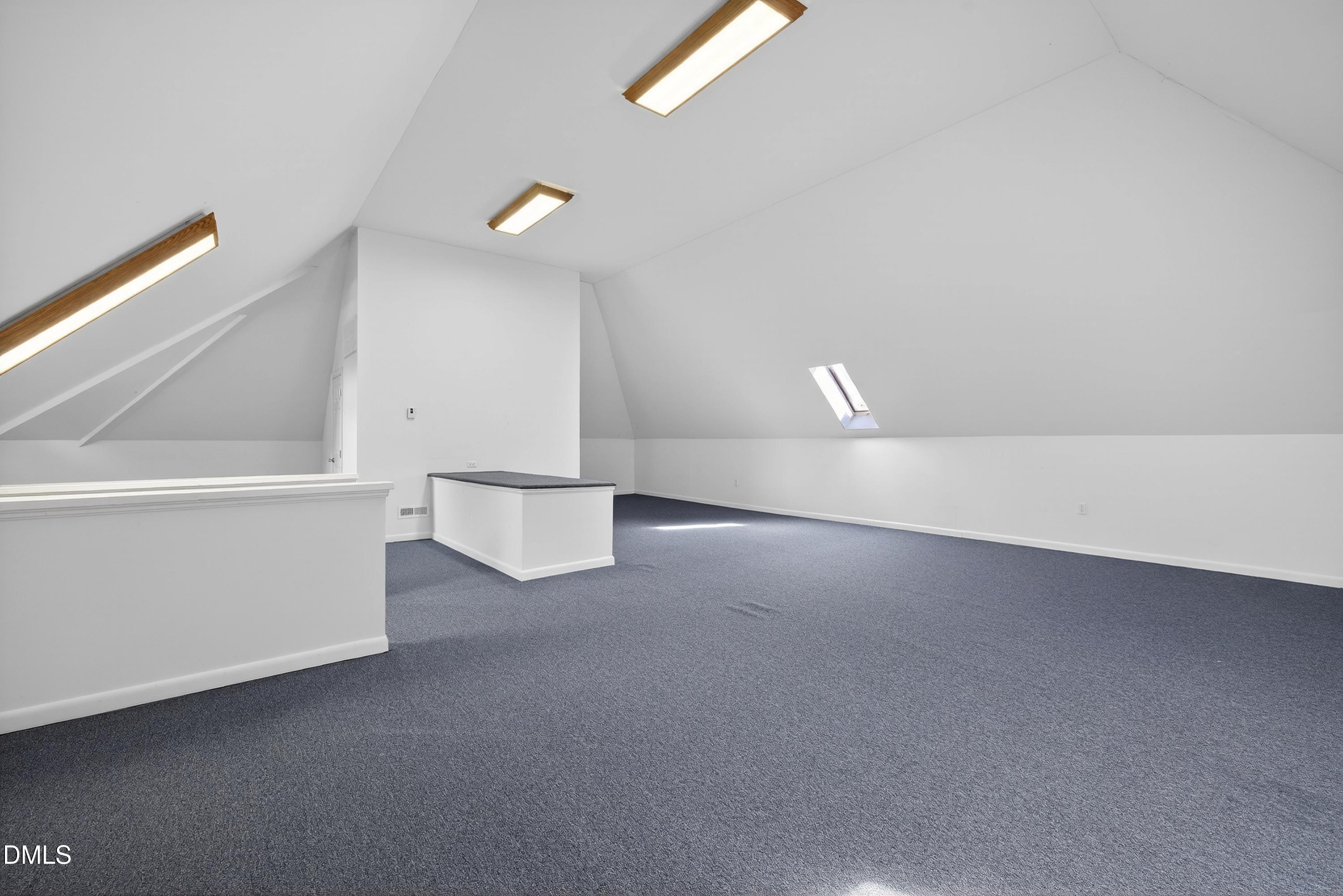 2217 Moss Point Lane Raleigh, NC 27606 - Photo 49 of 70 a view of a room with wooden floor and white walls